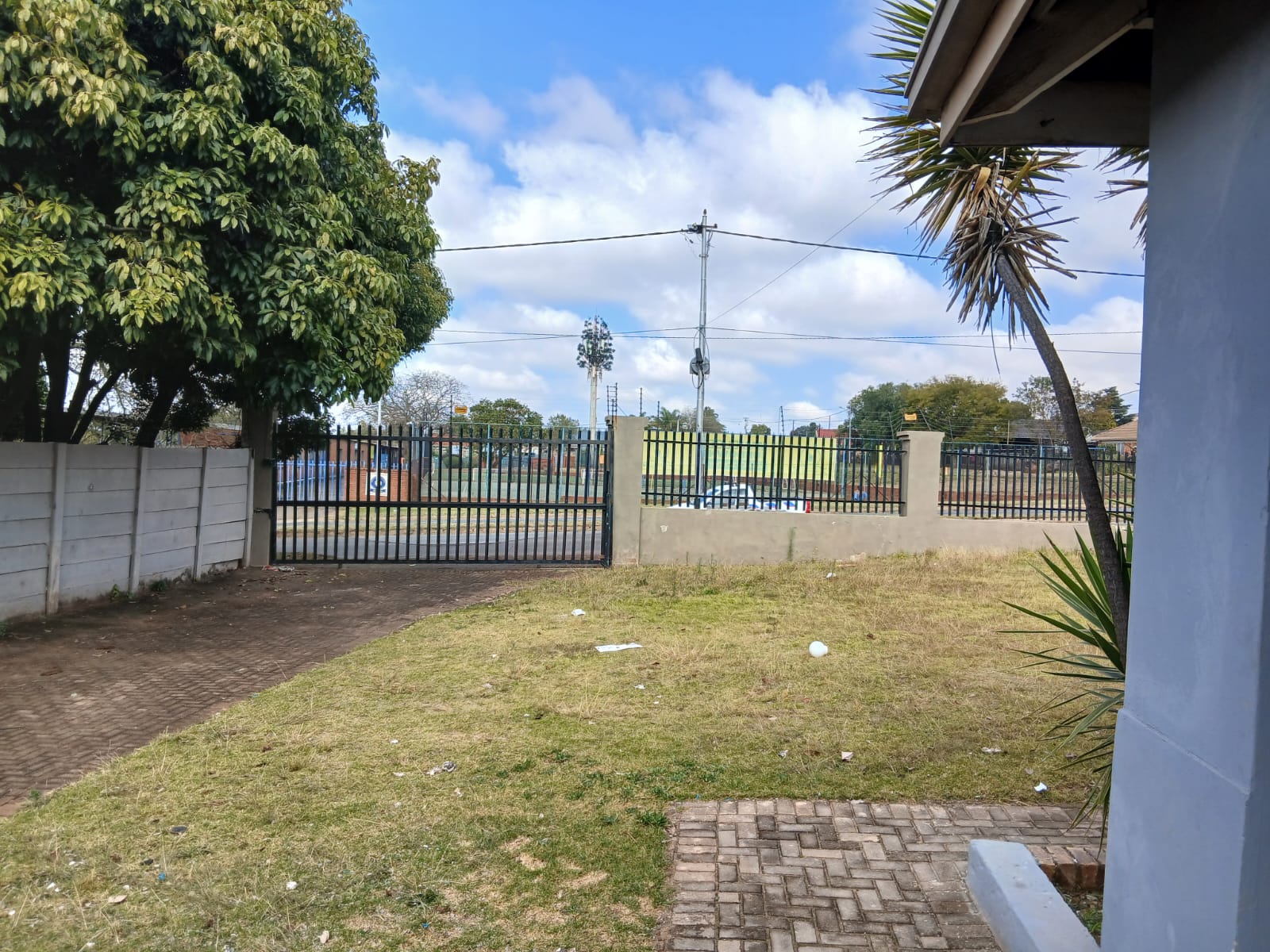 Garden view towards secure perimeter fence