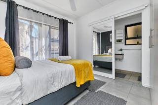 Second bedroom with built-in mirrored wardrobe