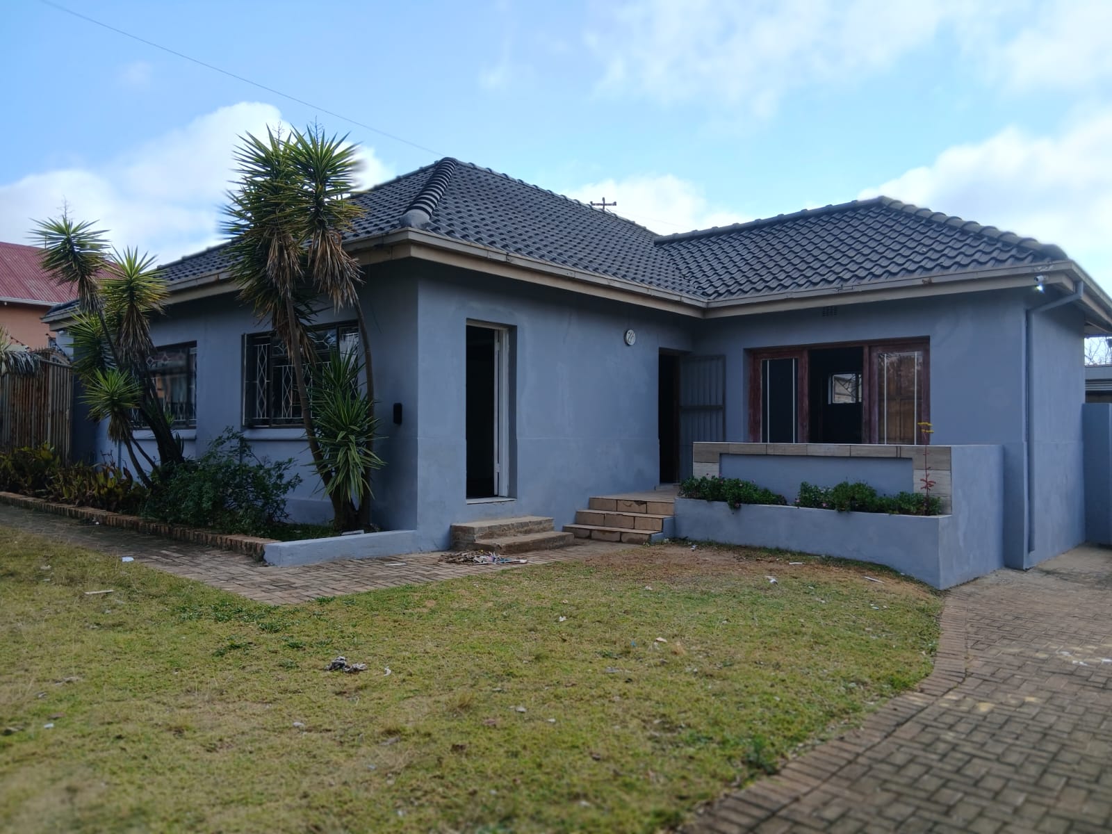 Cottage exterior with tiled roof and front garden