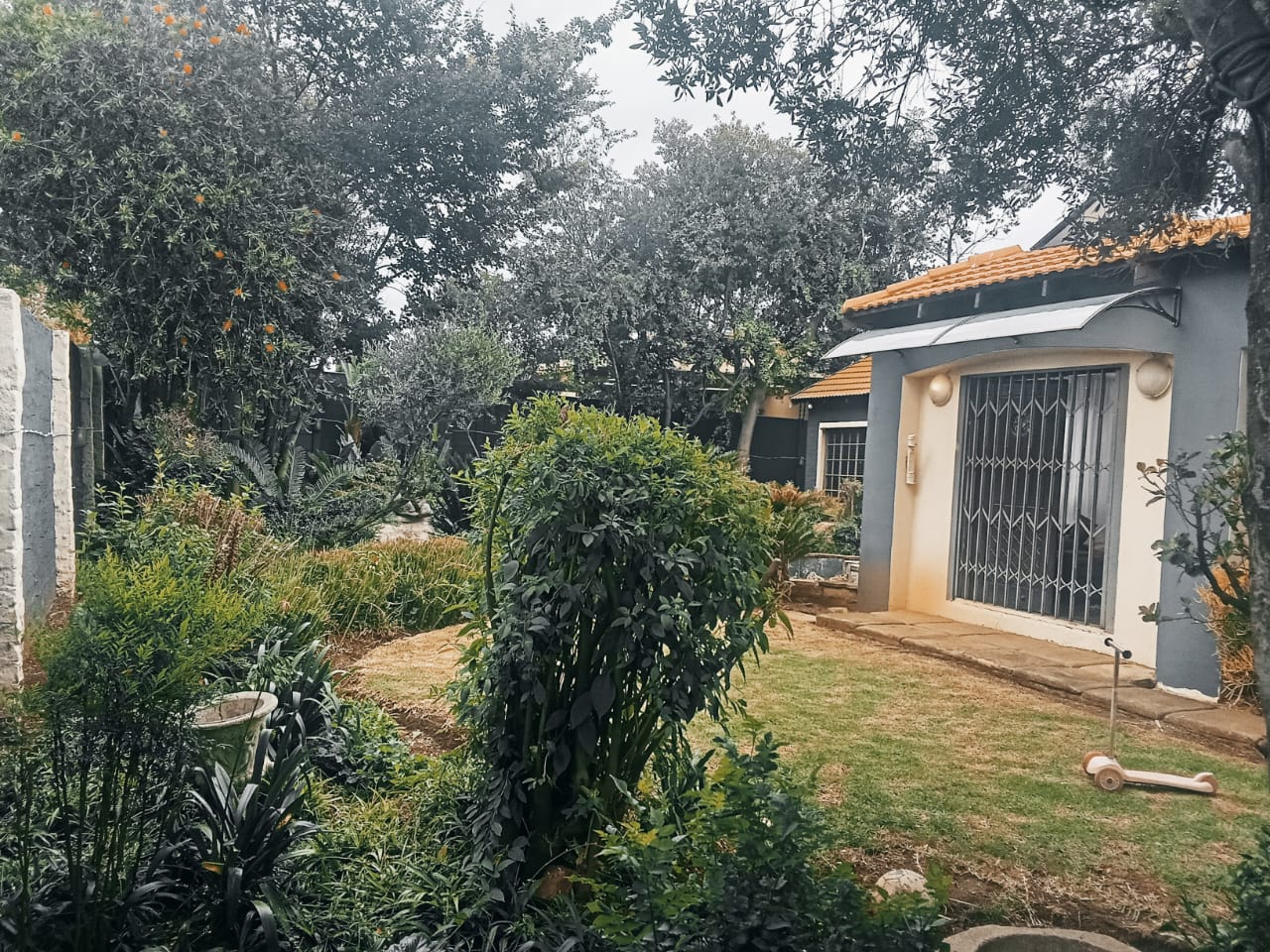 Established garden with cottage entrance