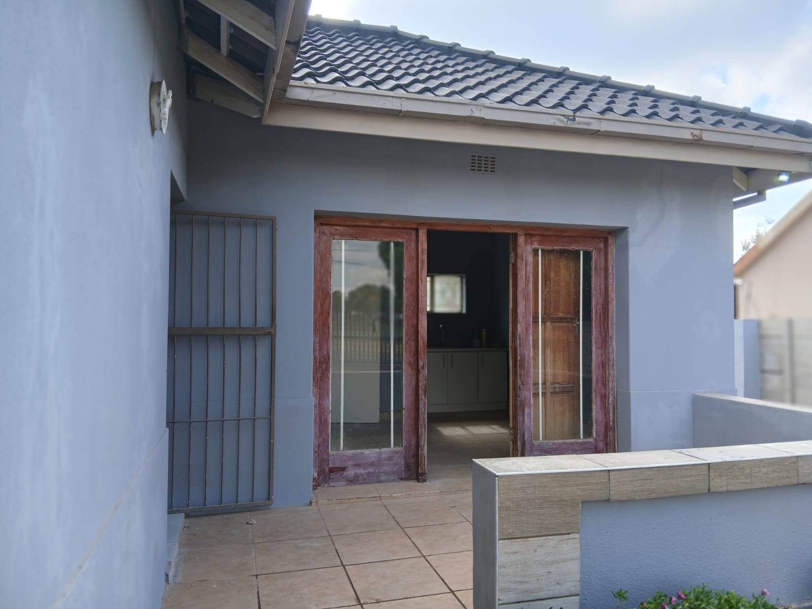 Cottage patio entrance with sliding doors